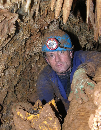 A caver in a cave